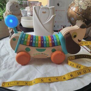 Wooden Alpha Pup Learning Toy, Pull along puppy teaches letters, sounds, songs.